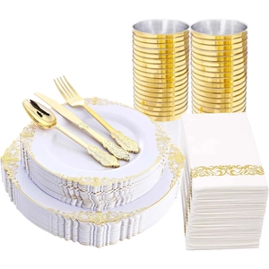 White disposable plastic tableware set with gold trim, plates, cups and gold cutlery