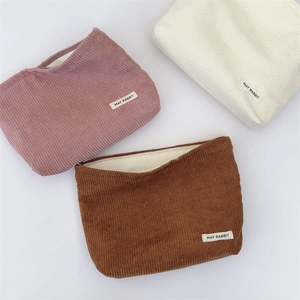 Detailed corduroy makeup bags in pink, beige, and brown with May Rabbit labels