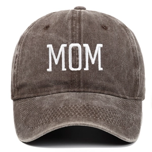 Detail of MOM embroidery on vintage washed cotton dark brown baseball cap with worn texture