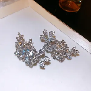 Elegant silver flower and leaf ear clips with sparkling rhinestones for non-pierced ears