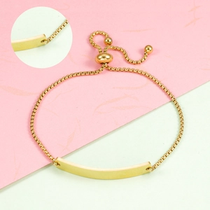 Detailed view of adjustable gold-plated stainless steel bar bracelet with box chain slider