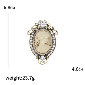Vintage bronze cameo brooch with elegant female silhouette and sparkling crystal accents
