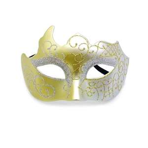 Macro view of gold and silver gradient glitter masquerade mask with ornate swirl patterns