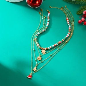 Detail of layered Christmas necklace with clay beads, gingerbread and snowflake pendants