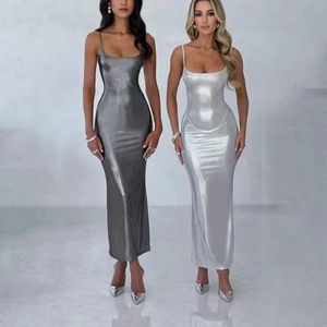 Detail of metallic bodycon maxi dress with thin straps in dark and light silver
