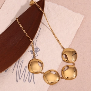 Detailed macro view of 18K gold plated necklace with 4 large irregular circular pendants