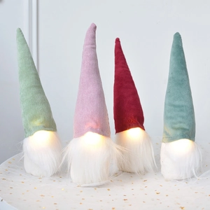 Set of four glowing Christmas velvet gnomes with long white beards on a star mesh base