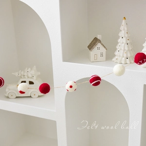 Red and white felt wool ball garland for festive Christmas tree hanging decoration