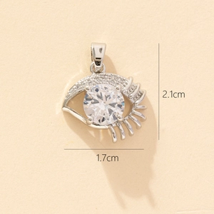 Detailed view of evil eye pendant with dimensions 1.7cm by 2.1cm and zircon inlay