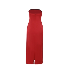 Close-up of red satin dress back featuring invisible zipper and bottom slit detail