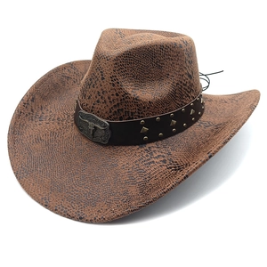 Brown western cowboy hat in faux snakeskin suede with bull head metal buckle detail