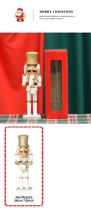 Close-up of 26cm white and gold wooden nutcracker soldier with its red gift box packaging