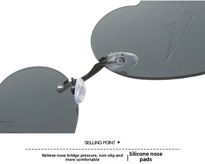Detailed macro view of soft silicone nose pads and metal bridge on heart sunglasses