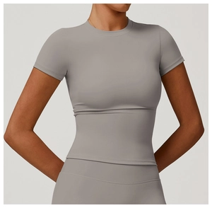 Close-up of light grey slim-fit yoga t-shirt with breathable quick-dry fabric texture