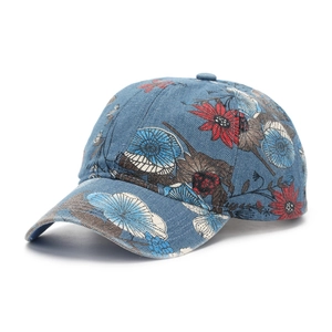 Detail of floral denim baseball cap showing vintage flower print and texture