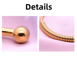 Close-up of golden stainless steel spring bracelet showing spherical ends and coil texture