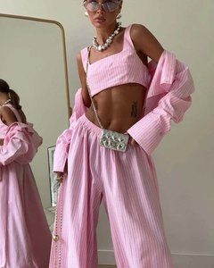 Detail of pink and white striped three-piece set with crop top and loose trousers