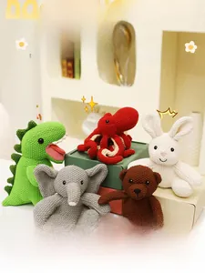 Detail of five handcrafted knitted animal plush toys with cotton crochet textures