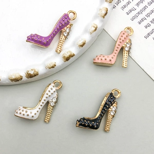 Detail of colorful high heel shoe charms with enamel finish and sparkling rhinestones
