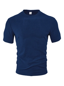 Detail view of navy blue polo shirt featuring M size label and textured jacquard fabric