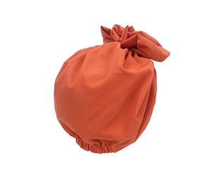 Close-up of orange retro flower pattern turban cap with elastic band detail