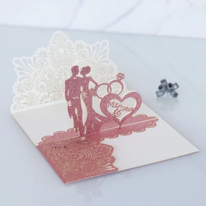 Detail of pink glitter 3D wedding card with Mr & Mrs laser cut heart design