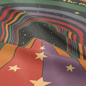 Macro shot of colorful rainbow tapestry fabric texture with retro stars and stripes