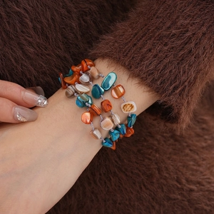 Bohemian multi-layer necklace with irregular shell beads in amber and turquoise