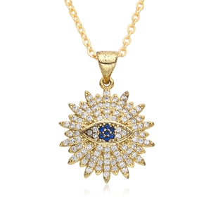 Golden sunburst necklace with evil eye pendant and zircon stones on white background