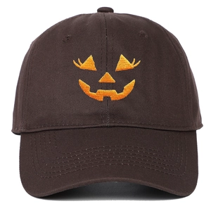 Dark brown cotton baseball cap with orange Halloween pumpkin embroidery on white background