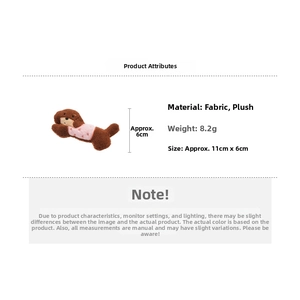 Detail view of plush puppy hair clip showing material dimensions 11cm by 6cm