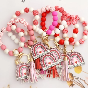 Valentine’s Day beaded wristlet keychain with wooden beads, leopard tag, and tassel