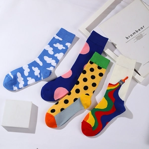 Colorful patterned mid-calf socks for men featuring polka dots and artistic paint splatters