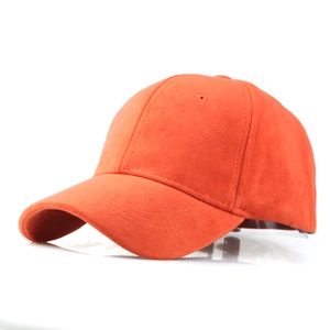Detail view of orange faux suede baseball cap showing fine texture and 6-panel structure