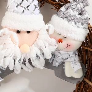 Christmas wreath with Santa and snowman plush dolls on wooden board with vine base decoration