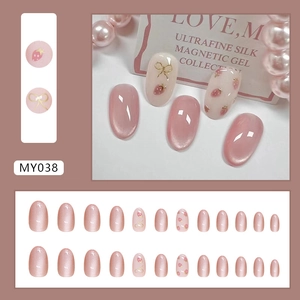 Cat eye bow press-on nails with cute strawberry pattern and velvet shimmer finish