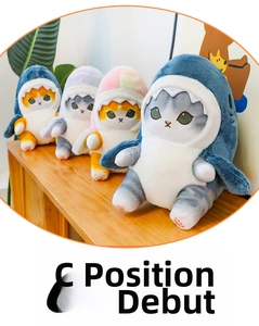 Detail of four colorful shark cat plush toys showing soft fabric and cute embroidery