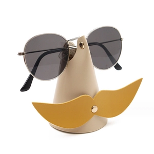Creative beige desktop leather eyewear stand with yellow mustache decor for sunglasses
