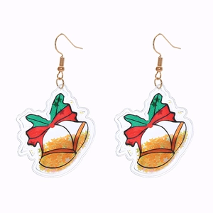 Detail of Christmas bell earrings with red-green bows and yellow glitter in acrylic