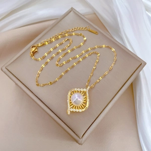 Luxurious bird nest mermaid style necklace with pearl and rhinestones on beige velvet