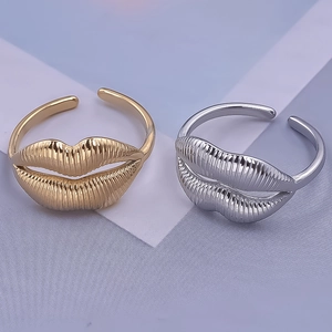 Detailed macro view of 304 stainless steel lip-shaped rings with realistic engraved textures