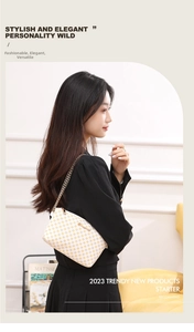 Detail of white mini crossbody bag with yellow check pattern and gold chain strap
