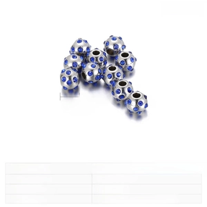 Macro shot of 10mm stainless steel beads set with blue rhinestones weighing 30g