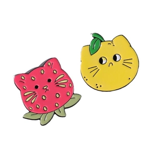 Kawaii fruit cat enamel pins featuring pink strawberry and yellow lemon cartoon designs