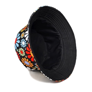 Detail of colorful daisy floral bucket hat featuring a black lining and stitched brim
