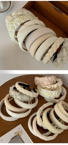 Detail view of assorted cream hairbands in satin, pearl, and knit textures on wood