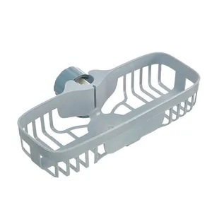 Gray-blue plastic faucet storage rack with hollow mesh design for kitchen sink drainage