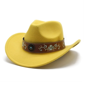 Detail of yellow felt cowboy hat featuring floral embroidery on brown leather band