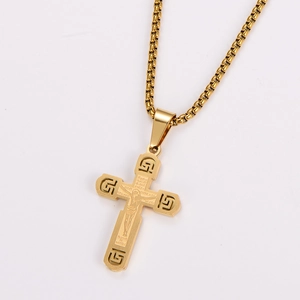 Detail of gold stainless steel cross necklace with engraved Spanish Lord's Prayer text