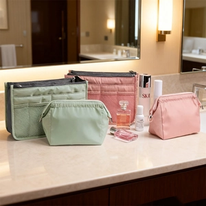 Waterproof travel cosmetic bag set with portable interior organizer in mint and pink